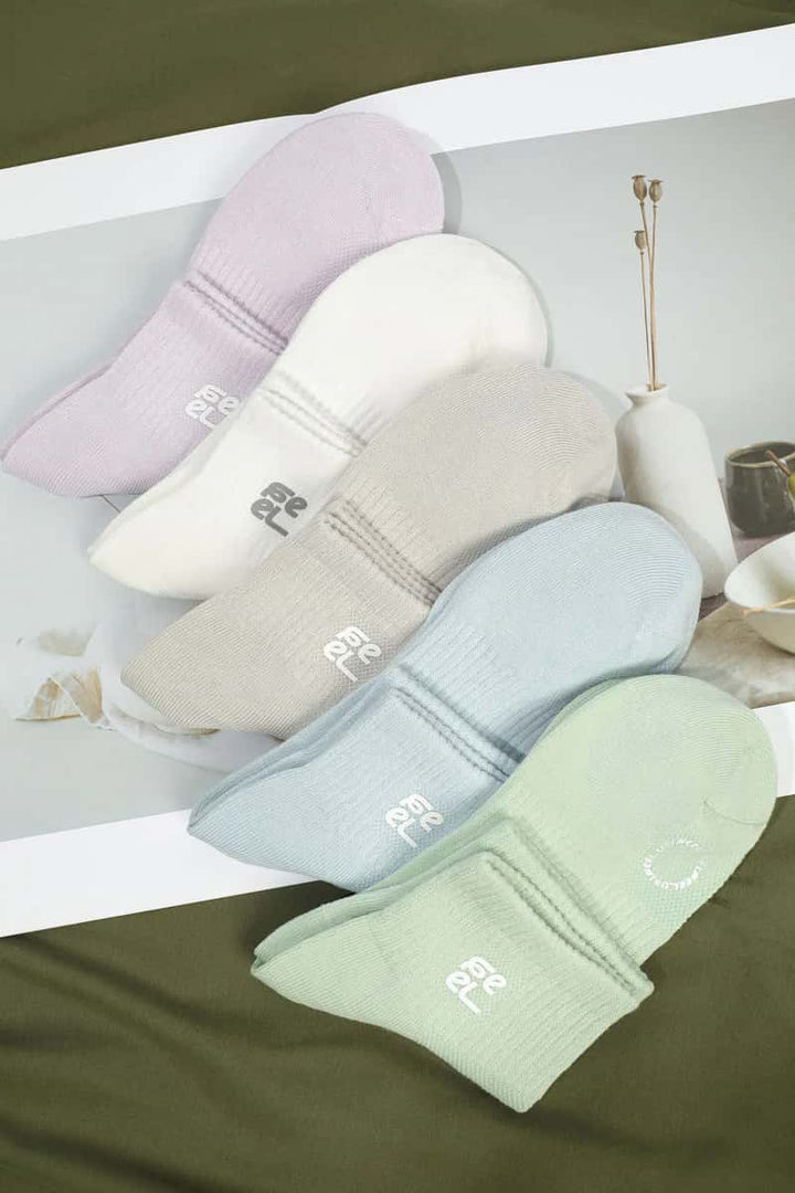 Set of four pairs of socks in pastel colors